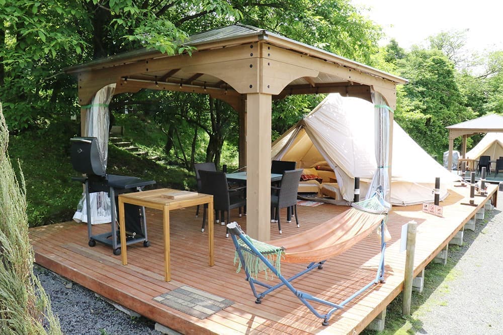 A gazebo with clear curtains for peace of mind on rainy days