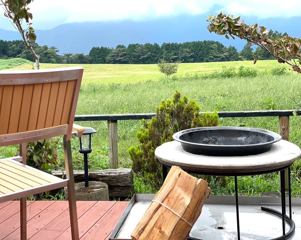 A campfire pit at the trailer house site of Urban Camping Asagiri Takarayama in Fujinomiya City, a campsite with a view of Mt. Fuji
